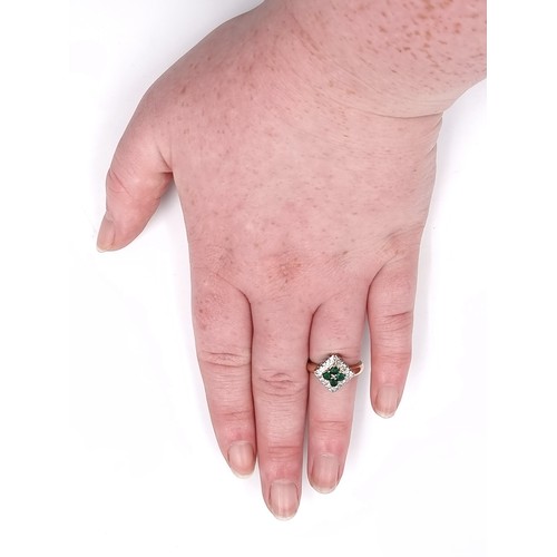 1 - Star Lot : An attractive nine carat gold mounted emerald and diamond ring. Size - J. Weight - 3.84 g... 