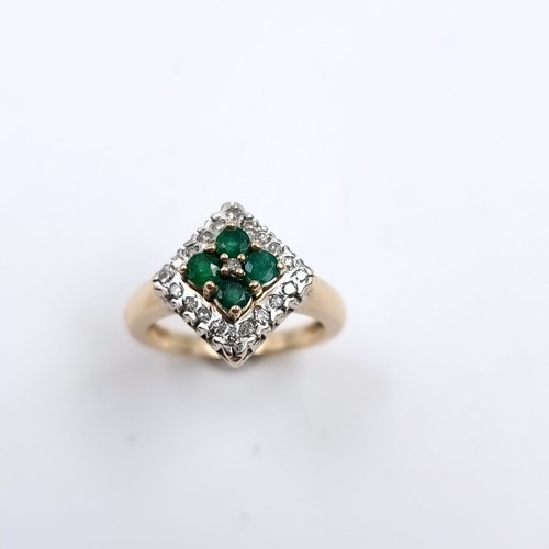 1 - Star Lot : An attractive nine carat gold mounted emerald and diamond ring. Size - J. Weight - 3.84 g... 