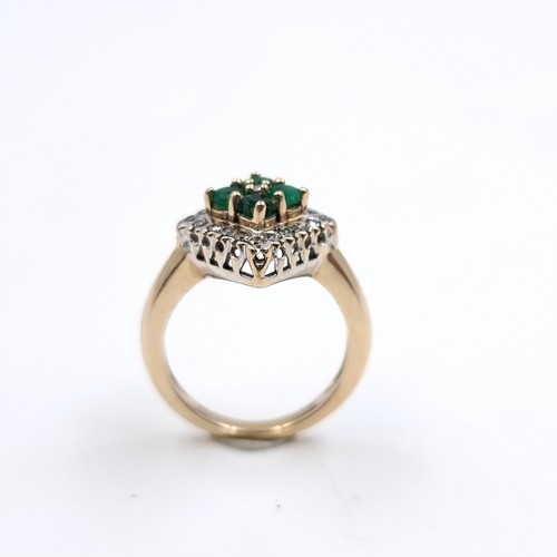 1 - Star Lot : An attractive nine carat gold mounted emerald and diamond ring. Size - J. Weight - 3.84 g... 