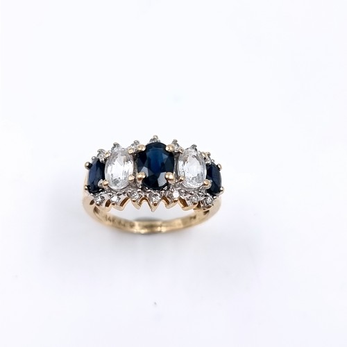 2 - Star Lot : A most attractive diamond ring set with white and blue sapphire stones, set in nine carat... 