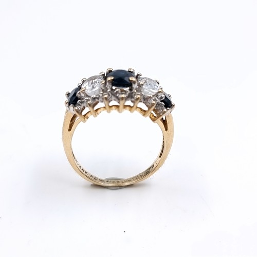 2 - Star Lot : A most attractive diamond ring set with white and blue sapphire stones, set in nine carat... 