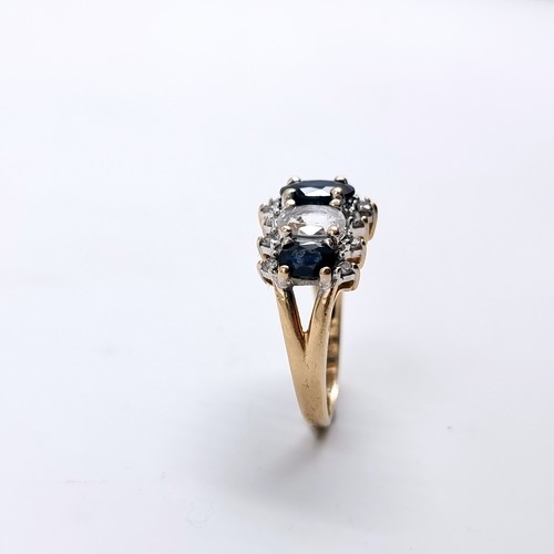 2 - Star Lot : A most attractive diamond ring set with white and blue sapphire stones, set in nine carat... 