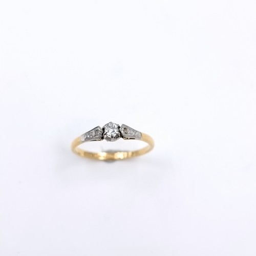 3 - An 18 carat gold ring with central diamond, estimated weight - 0.25cts. Set with diamond shoulders. ... 