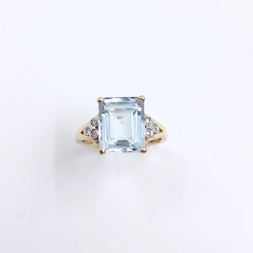 4 - Star Lot : A lovely nine carat gold large aquamarine stone ring with diamond set accents to shoulder... 