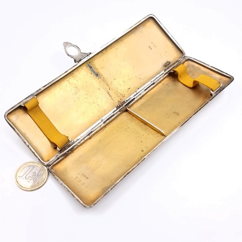 25 - An attractive unusual art deco sterling silver engine turned cigarette case with unusual gold mount ... 