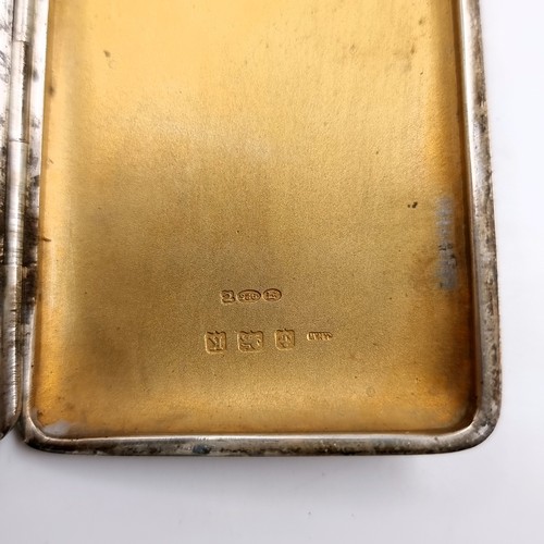 25 - An attractive unusual art deco sterling silver engine turned cigarette case with unusual gold mount ... 