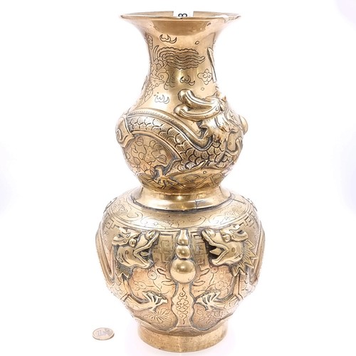 Star Lot : A fine example of a very heavy  late 19th century double gourd Qing Dynasty engraved and molded brass pot with character marks to base. Dimensions - Height 34cm x 17cm. Weight - 2820 grams. Fabulous Dragon in high relief.