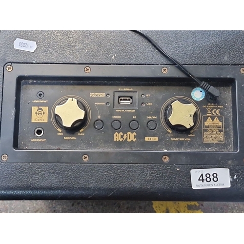 488 - AC/DC branded amplifier, black with gold trim. iDance portable wireless PA system, model TNT-3, powe... 