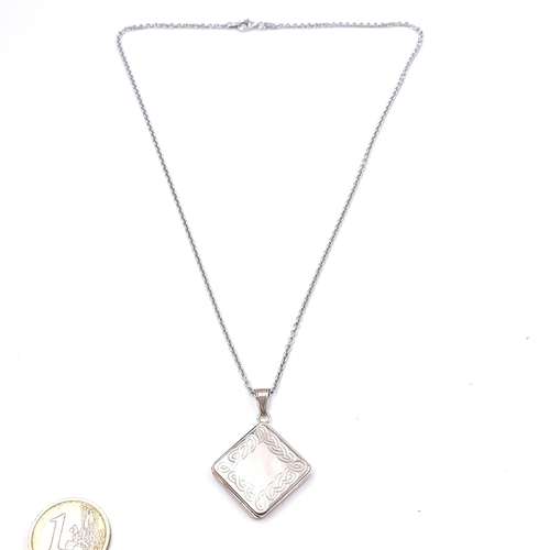 522 - An attractive sterling silver 925 hinged locket and chain, locket with foliate design. Length 44cm. ... 