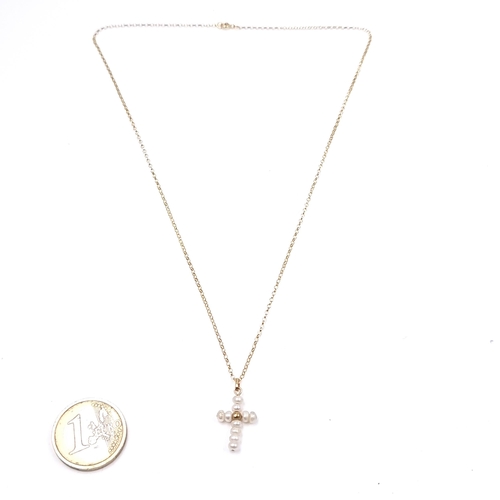 523 - Star Lot: A nine carat gold pearl pendant cross and chain. Length 46cm. Weight 1.168 grams. Boxed. T... 