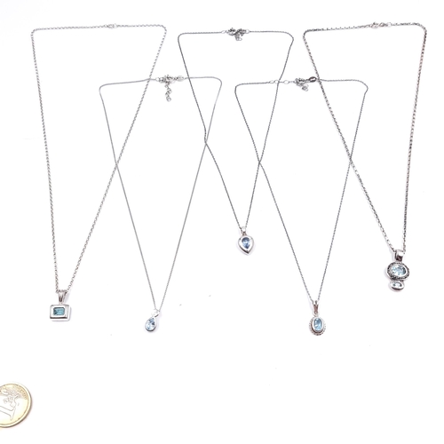 531 - A collection of five sterling silver necklaces, three set with blue topaz gemstone pendants. Lengths... 