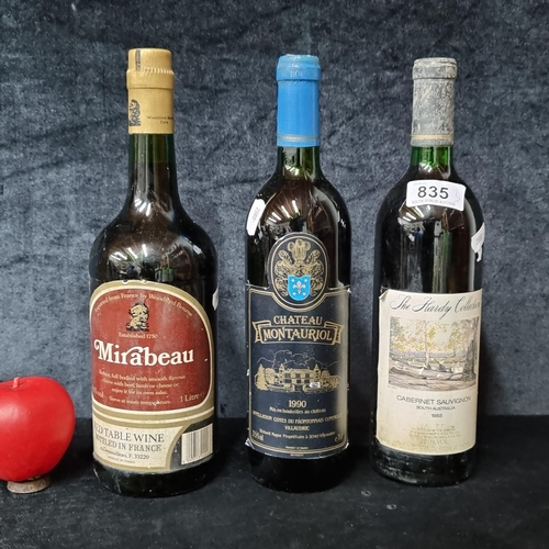 835 - Three bottles of red wine including a 1990 Chateau Montauriol, a 1988 The Hardy Collection Australia... 