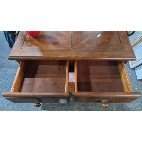 918 - A handsome hallstand with mirror, two drawers, and lower shelf. Features ornate carvings and wrought... 