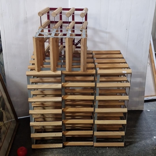 924 - Collection of wooden and metal wine racks in various sizes. Three big and 2 small.