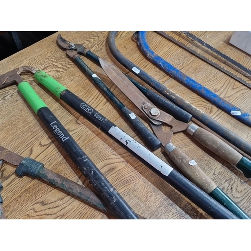 958 - Collection of vintage garden tools including shears, loppers, and bow saws. Brands include Legend an... 