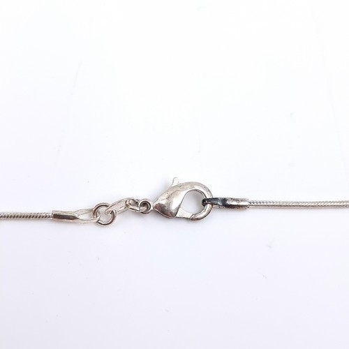 503 - A sterling silver lapis lazuli circular pendant and chain. Length 44cm. Weight 11 grams.