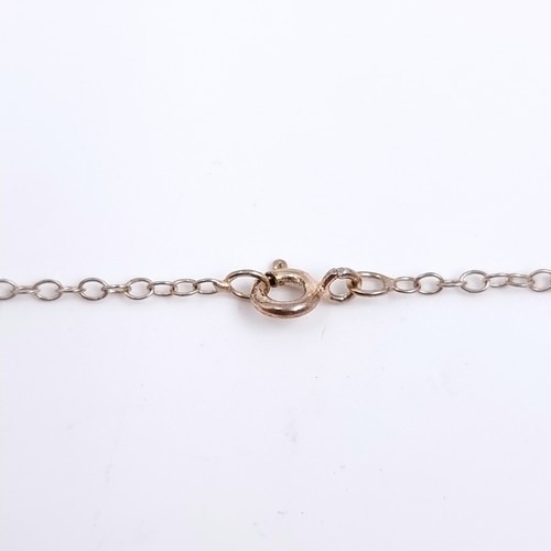505 - A bright pink tourmaline pendant mounted in sterling silver with a sterling silver chain. Length 46c... 