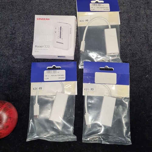 138 - Sangean Pocket 320 SR-32 radio, boxed. Three USB-C to RJ45 adapter cables, packaged. These items are... 