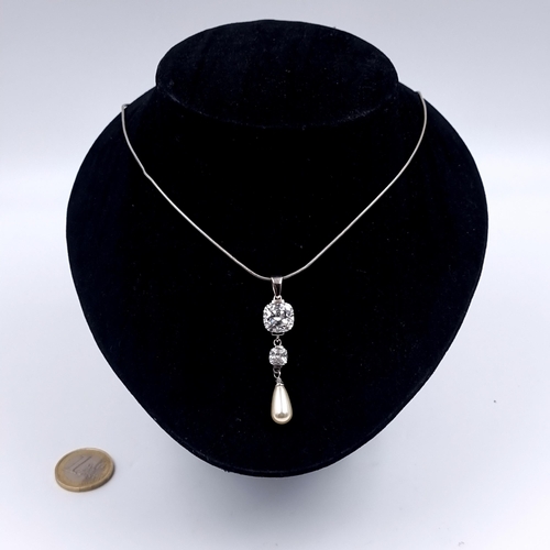 154 - A sterling silver 925 gemstone and pearl pendant together with a 925 sterling silver chain. Length 4... 