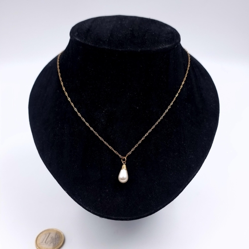 156 - Star Lot: A nine carat gold (9K) pearl pendant necklace. Length 46cm. Weight 1.10 grams. Boxed.