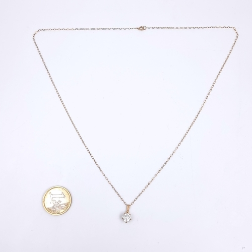162 - A nine carat gold chain set with a gemstone pendant. Length 52cm. Weight of chain 0.85 grams.