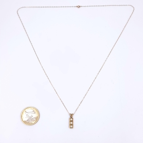 164 - Star Lot: A nine carat gold gemstone pendant and chain. Length 50cm. Weight 1.34 grams.