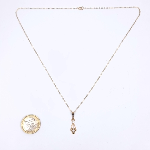 165 - Star Lot: A nine carat gold gemstone and pearl pendant, together with a nine carat gold chain. Lengt... 