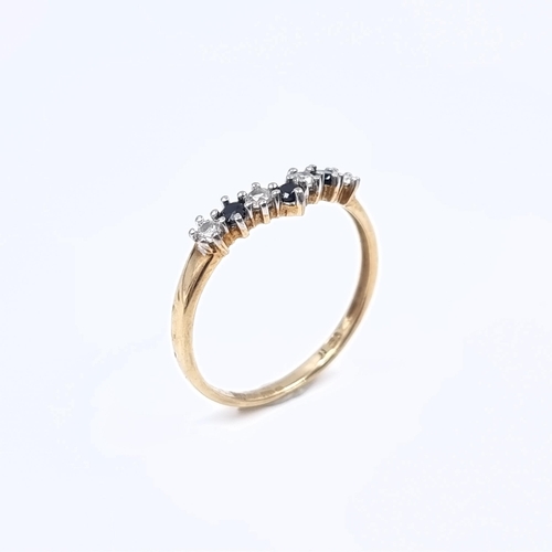 174 - Star Lot: A nine carat gold 375 gemstone wishbone ring. Size P. Weight 1.32 grams.