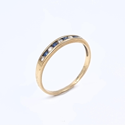 177 - Star Lot: A sapphire and gemstone half eternity ring set in nine carat gold 375. Size P. Weight 1.31... 