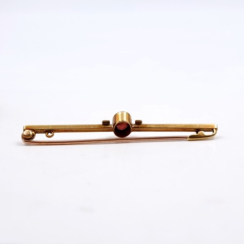 149 - Star Lot: A beautiful 15 carat gold garnet and seed pearl brooch. Length 5.5cm. Weight 3.6 grams. Pr... 