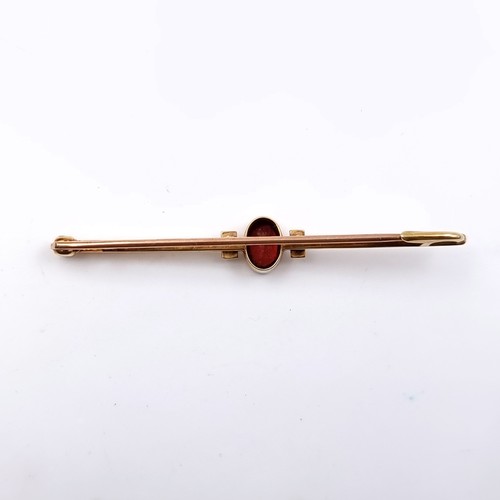 149 - Star Lot: A beautiful 15 carat gold garnet and seed pearl brooch. Length 5.5cm. Weight 3.6 grams. Pr... 