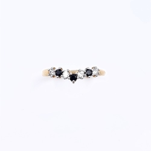 174 - Star Lot: A nine carat gold 375 gemstone wishbone ring. Size P. Weight 1.32 grams.