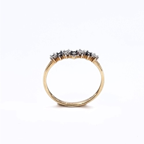 174 - Star Lot: A nine carat gold 375 gemstone wishbone ring. Size P. Weight 1.32 grams.