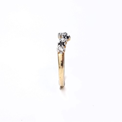 174 - Star Lot: A nine carat gold 375 gemstone wishbone ring. Size P. Weight 1.32 grams.