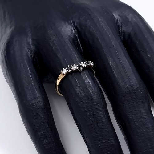 174 - Star Lot: A nine carat gold 375 gemstone wishbone ring. Size P. Weight 1.32 grams.