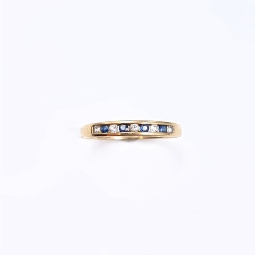 177 - Star Lot: A sapphire and gemstone half eternity ring set in nine carat gold 375. Size P. Weight 1.31... 