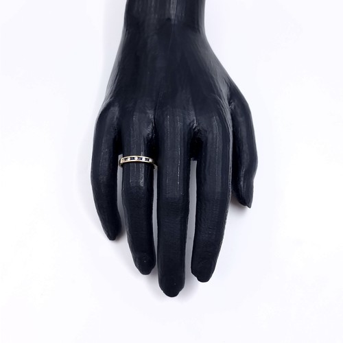 177 - Star Lot: A sapphire and gemstone half eternity ring set in nine carat gold 375. Size P. Weight 1.31... 