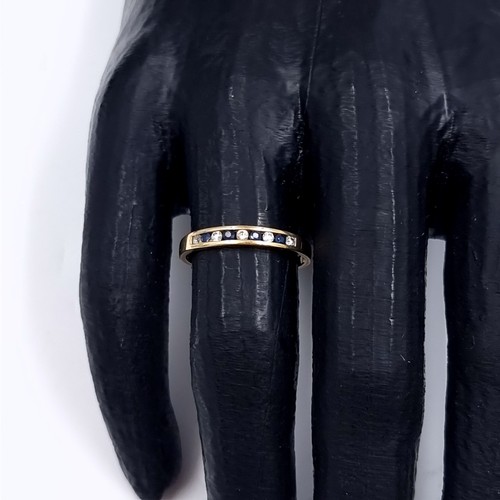 177 - Star Lot: A sapphire and gemstone half eternity ring set in nine carat gold 375. Size P. Weight 1.31... 