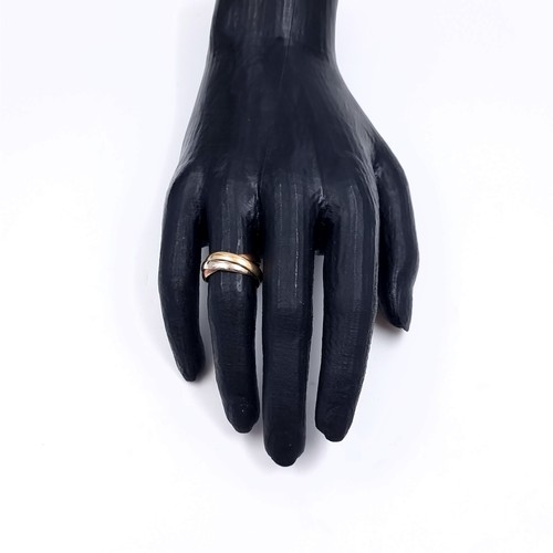 178 - Star Lot: A nine carat gold 375 tri colour Russian wedding ring. Size O. Weight 3.76 grams.