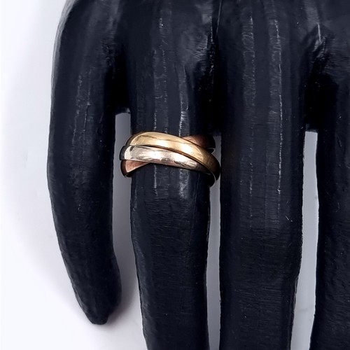 178 - Star Lot: A nine carat gold 375 tri colour Russian wedding ring. Size O. Weight 3.76 grams.