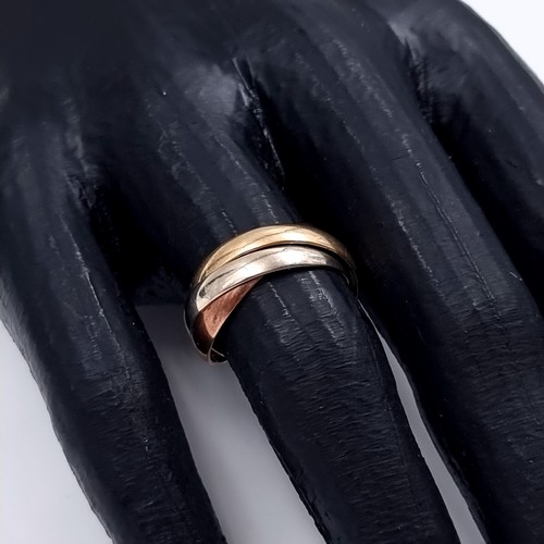 178 - Star Lot: A nine carat gold 375 tri colour Russian wedding ring. Size O. Weight 3.76 grams.