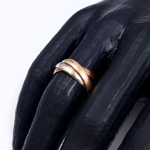 178 - Star Lot: A nine carat gold 375 tri colour Russian wedding ring. Size O. Weight 3.76 grams.
