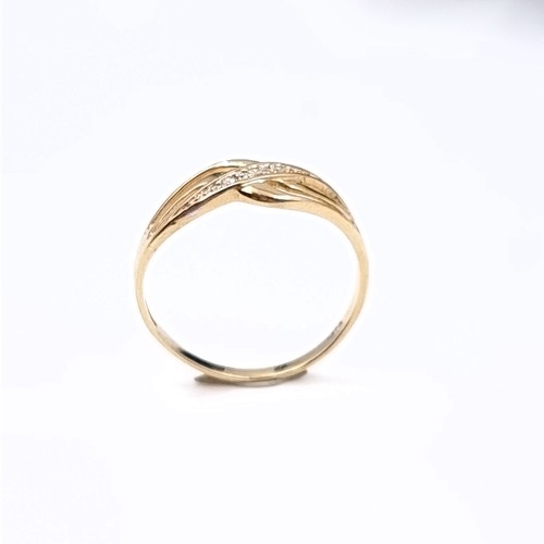 180 - Star Lot: A beautiful diamond ring set in nine carat gold 375. Size O1/2. Weight 1.20 grams.