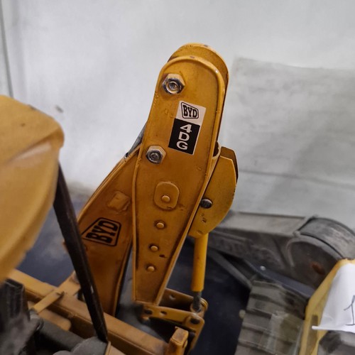 A large vintage Lesser & Pavey tin plate BYD 4dg digger.