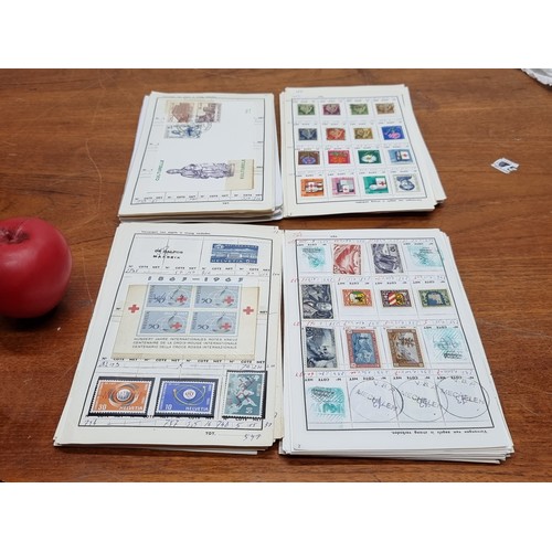 Aprprox 100 looses pages of world Stamps and world covers. approx 90-95% full. All unchecked stamps on hinges.