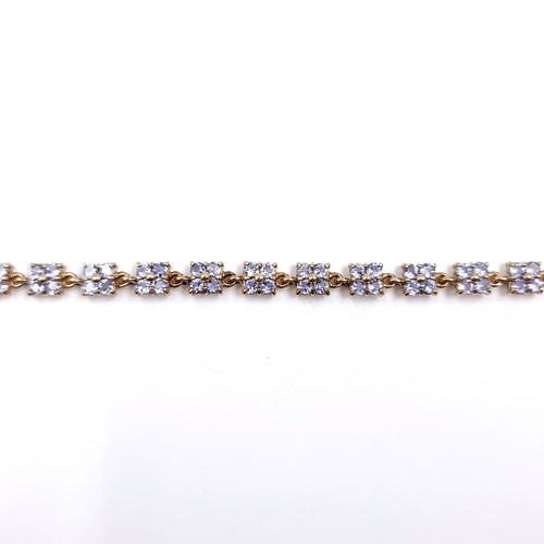 1 - Super Star Lot: A rare and beautiful tanzanite line bracelet set in nine carat gold. Weight 9 grams.... 