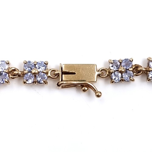 1 - Super Star Lot: A rare and beautiful tanzanite line bracelet set in nine carat gold. Weight 9 grams.... 