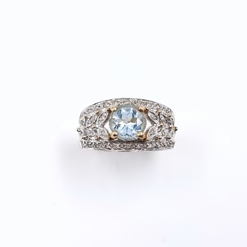 3 - Star Lot: A fine aquamarine and diamond ring set in nine carat gold. Size M. Weight 3.52 grams. Ther... 