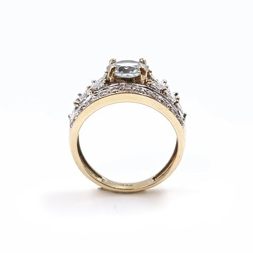 3 - Star Lot: A fine aquamarine and diamond ring set in nine carat gold. Size M. Weight 3.52 grams. Ther... 