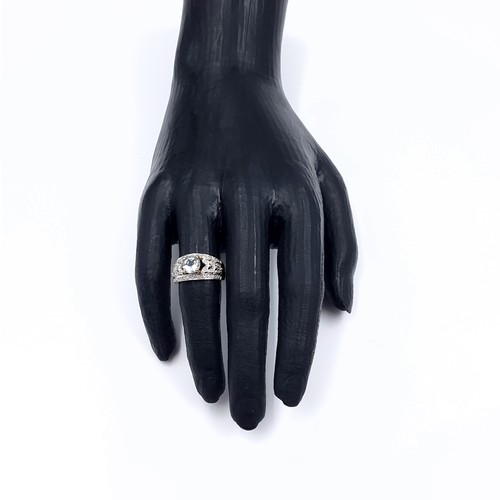 3 - Star Lot: A fine aquamarine and diamond ring set in nine carat gold. Size M. Weight 3.52 grams. Ther... 